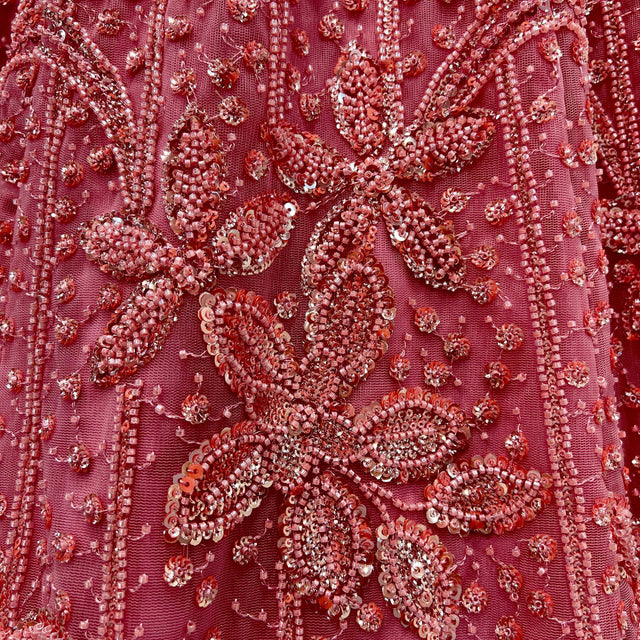 Beaded pearl and sequin embroidery on blush pink fabric