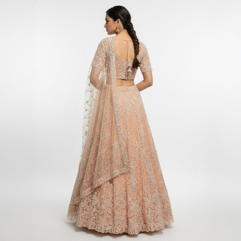 Peach sequin lehenga with cropped blouse and sheer embroidered dupatta, open back