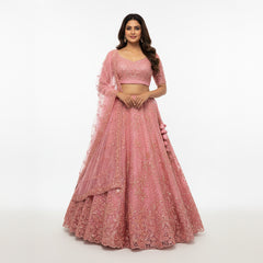 Blush pink sequin lehenga with matching blouse and sheer embellished dupatta