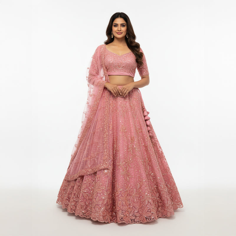 Blush pink sequin lehenga with matching blouse and sheer embellished dupatta