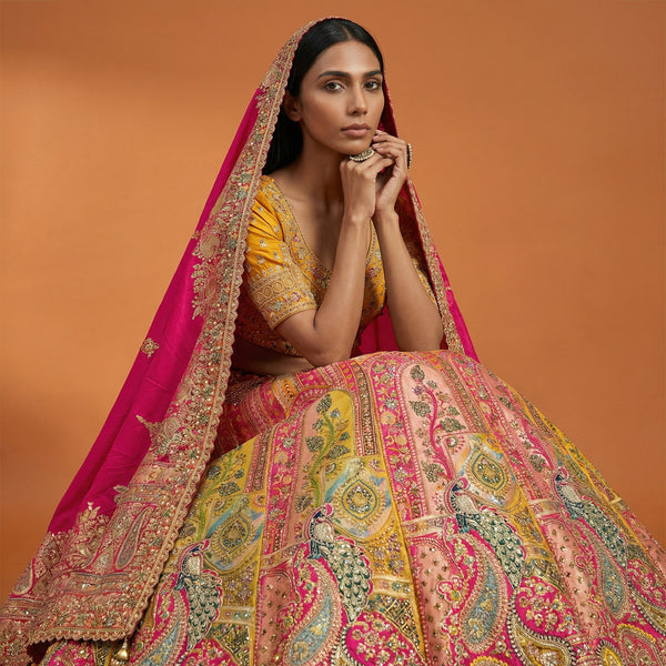 Multicolor lehenga with ornate paisley skirt, short blouse, gold-trim magenta dupatta