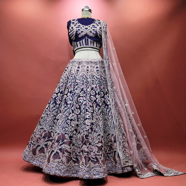 Purple embroidered flared lehenga with fitted blouse and sheer embroidered dupatta