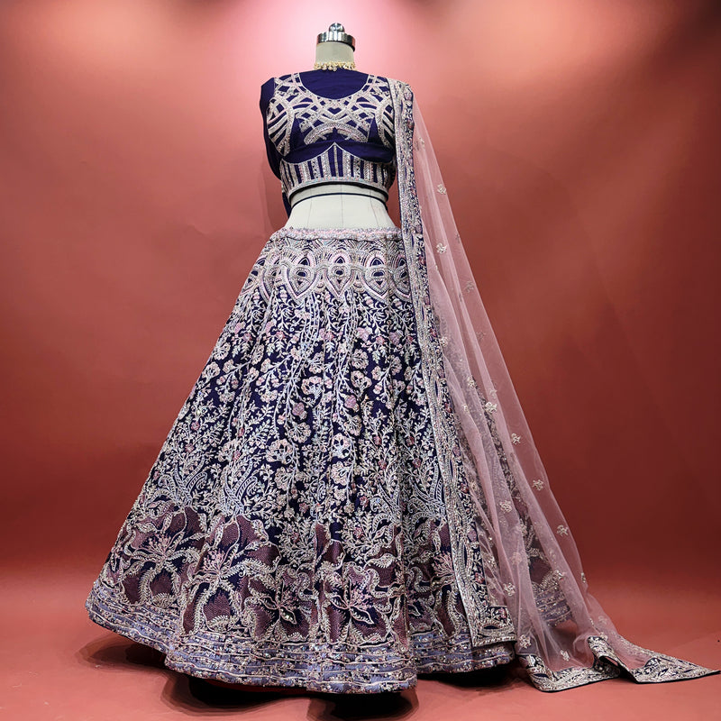 Purple embroidered flared lehenga with fitted blouse and sheer embroidered dupatta