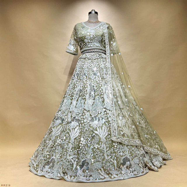 Sage green embroidered lehenga with ornate pearl work, matching short-sleeve blouse