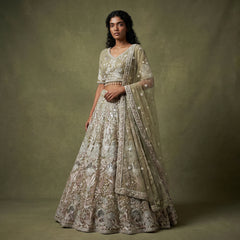 Embroidered sage green lehenga with pearl-like floral motifs and matching sheer dupatta