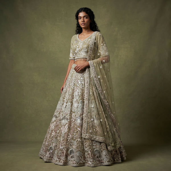 Embroidered sage green lehenga with pearl-like floral motifs and matching sheer dupatta