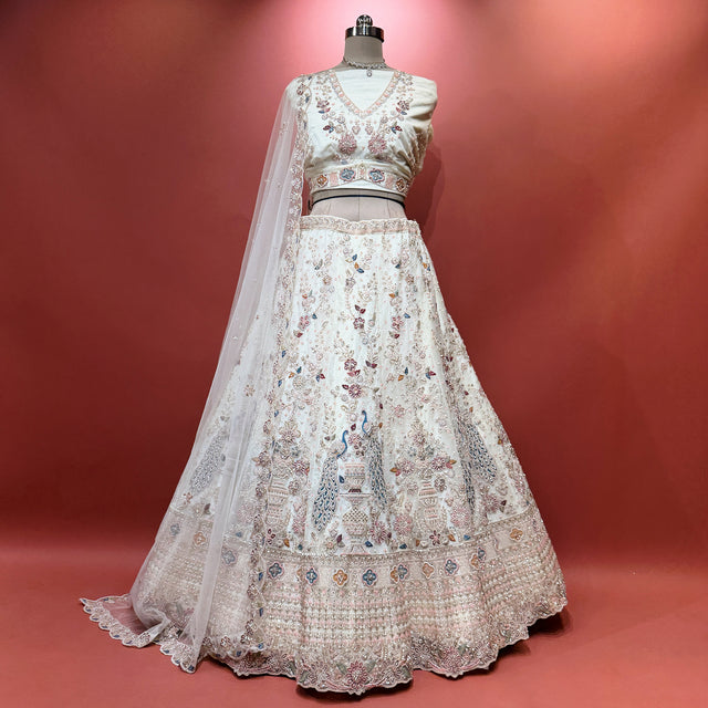 Offwhite peacock lehenga with golden bead and cutdana embroidery, sheer dupatta