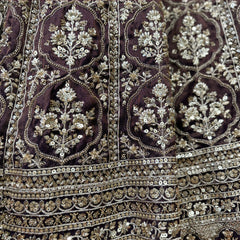 Embroidered wine lehenga fabric with ornate gold cutdana mirrorwork and sequin border