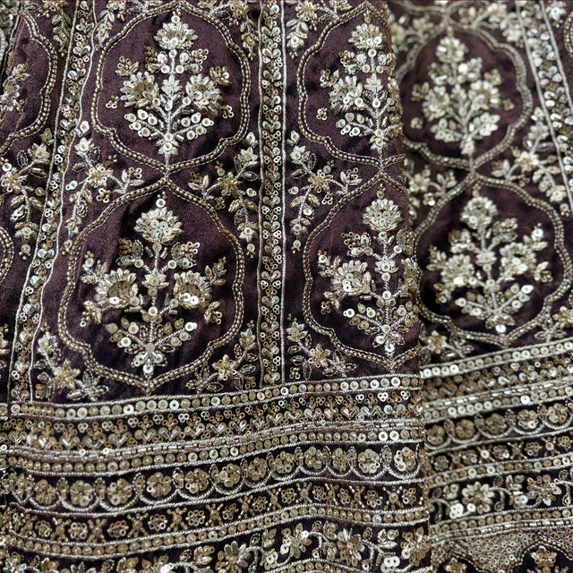 Embroidered wine lehenga fabric with ornate gold cutdana mirrorwork and sequin border