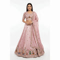 Baby pink designer lehenga with embroidered blouse and floral motif skirt