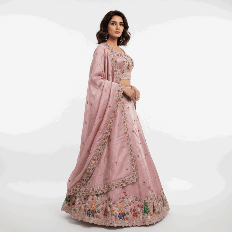 Pink designer lehenga set with floral motifs, embroidered border, flared scalloped hem