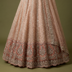 Peach embroidered lehenga skirt with floral cutwork panels and ornate scalloped hem
