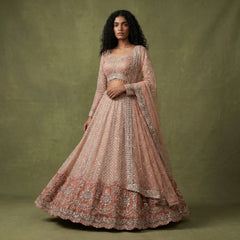Peach embroidered lehenga with sheer long-sleeve top and scalloped dupatta