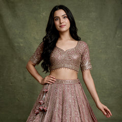 Mauve embroidered lehenga blouse with scalloped sleeves and flared skirt, beadwork