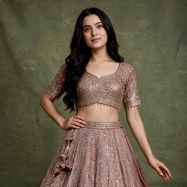 Mauve embroidered lehenga blouse with scalloped sleeves and flared skirt, beadwork