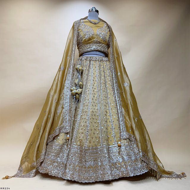 Somber yellow designer lehenga with silver sequin embroidery and flared skirt