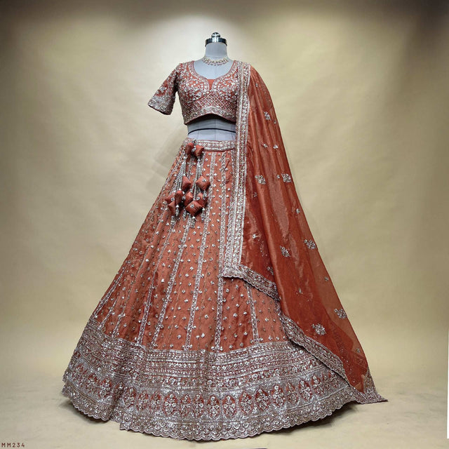 Orange designer lehenga with silver sequin and bead embroidery, flared skirt and dupatta