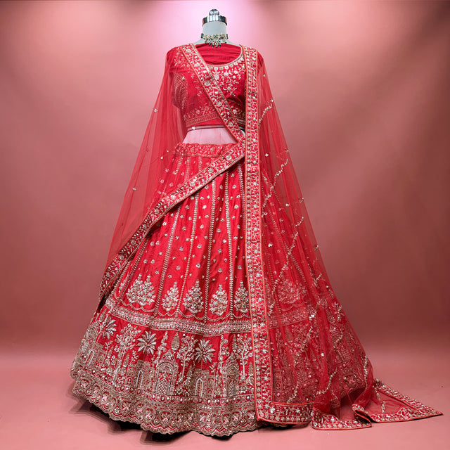 Red bridal lehenga with ornate border embroidery and sheer double dupatta