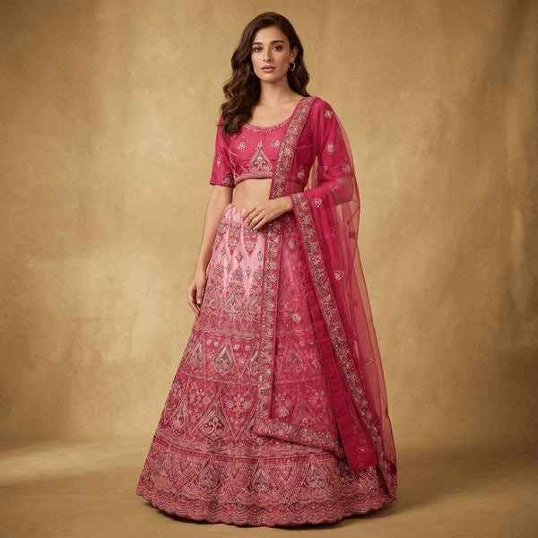 Embroidered pink lehenga with ornate border and sheer magenta dupatta