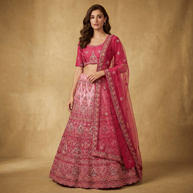 Embroidered pink lehenga with ornate border and sheer magenta dupatta