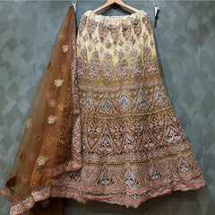 Embroidered gold net lehenga skirt with multicolor motifs; sheer dupatta