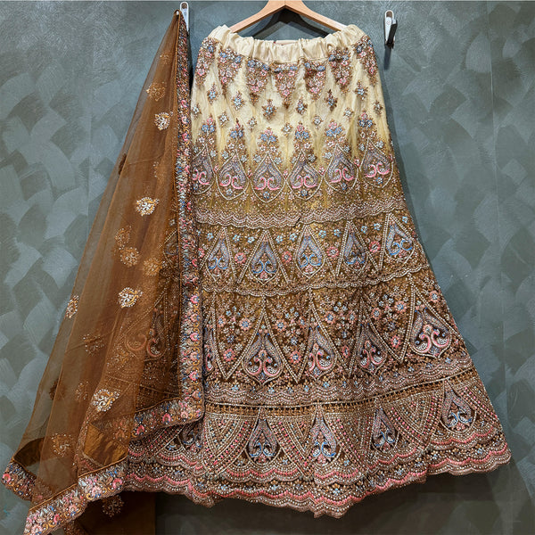 Embroidered gold net lehenga skirt with multicolor motifs; sheer dupatta
