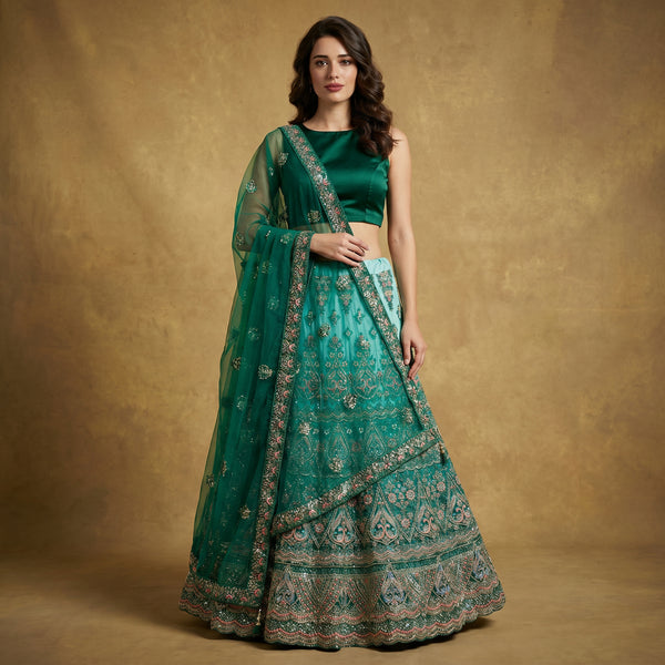 Green embroidered lehenga with gold trim and matching net dupatta