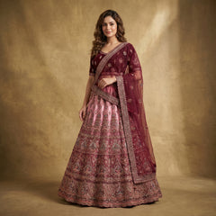 Maroon embroidered lehenga with tiered skirt and matching net dupatta