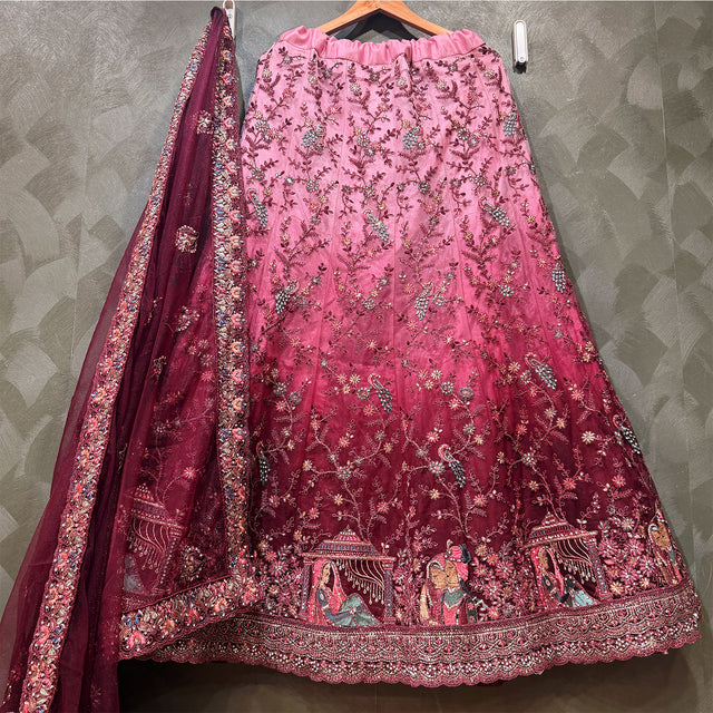 Embroidered pink maroon lehenga skirt with ornate hem border and allover motifs