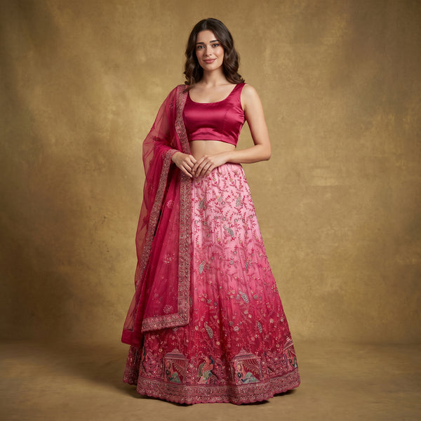 Pink embroidered lehenga set with satin blouse and sheer net dupatta, flared skirt
