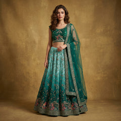 Teal-green lehenga set with embroidered blouse, flared skirt, and net dupatta