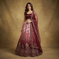 Maroon ombre embroidered lehenga with net dupatta, floral border details