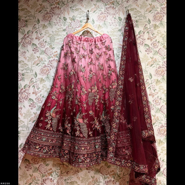 Maroon lehenga skirt with allover embellished floral embroidery and contrasting hem border