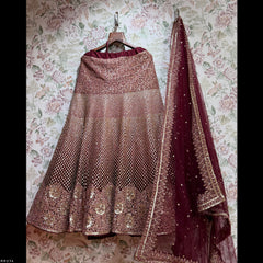 Rose-gold sequined lehenga skirt with maroon dupatta and golden border