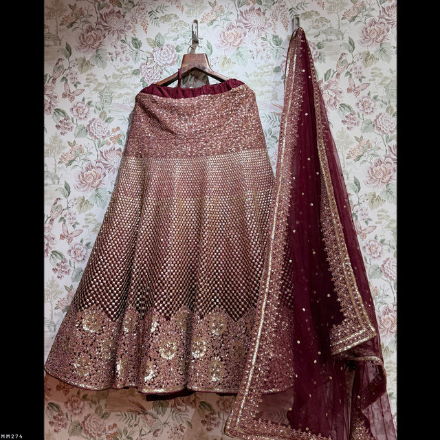Rose-gold sequined lehenga skirt with maroon dupatta and golden border