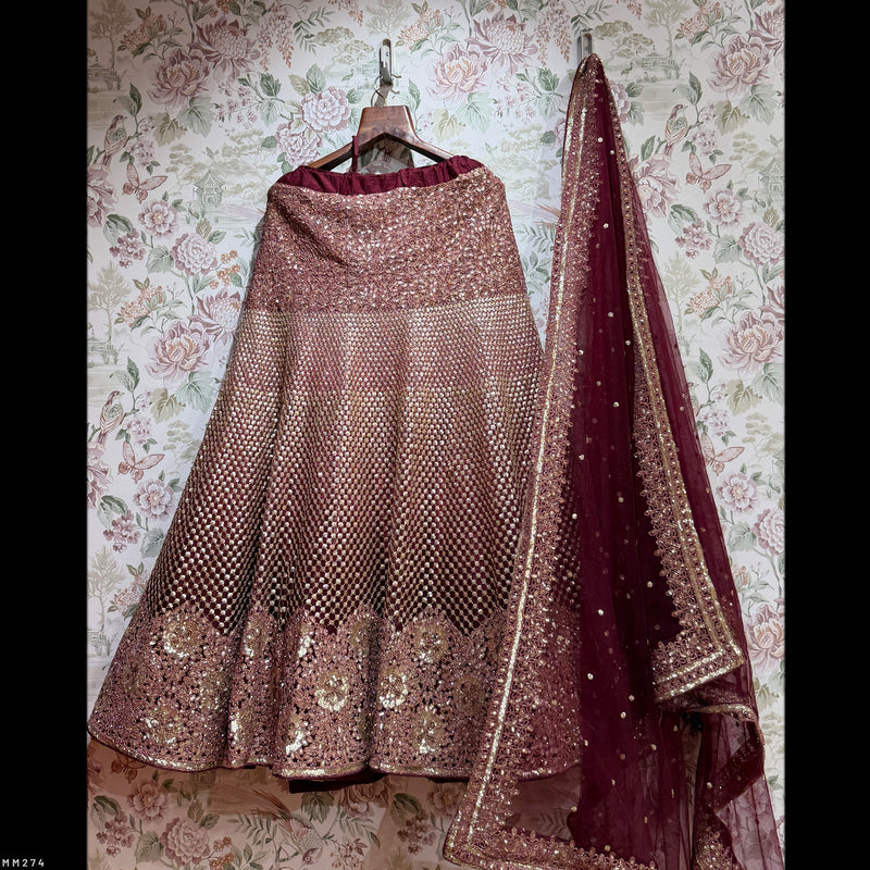 Rose-gold sequined lehenga skirt with maroon dupatta and golden border