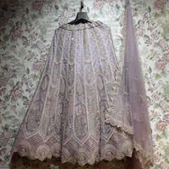 Lavender embroidered lehenga with vertical motif panels and matching dupatta veil