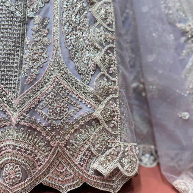 Lavender net lehenga with silver dori & cutdana peacock panel embroidery, scalloped border