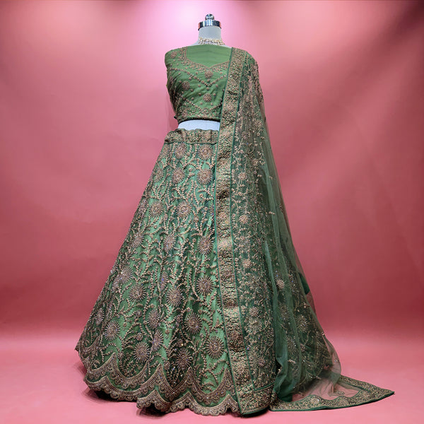 Green embroidered modern lehenga with draped matching dupatta