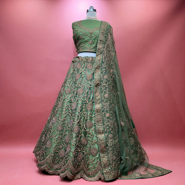 Green embroidered modern lehenga with draped matching dupatta