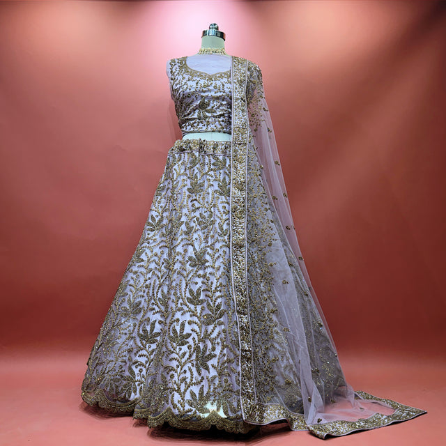 Embellished lehenga with fitted bodice, full skirt and sheer net dupatta