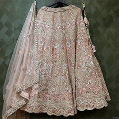 Peach embellished lehenga with matching blouse and sheer embroidered dupatta