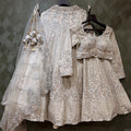 Pearl white couture lehenga with ornate lace embroidery and matching sheer dupatta