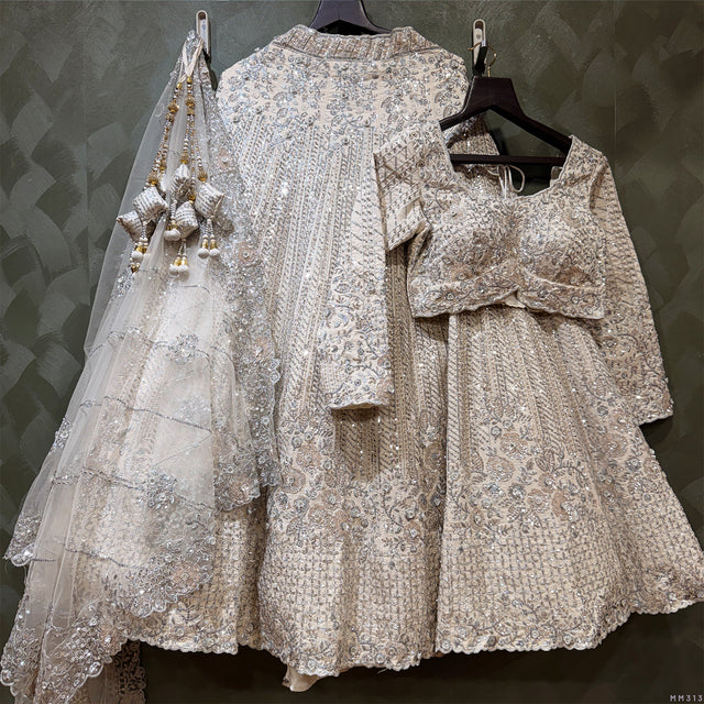 Pearl white couture lehenga with ornate lace embroidery and matching sheer dupatta