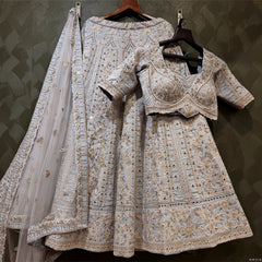 Sky blue lehenga and blouse set with intricate silver mirrorwork, sheer net dupatta