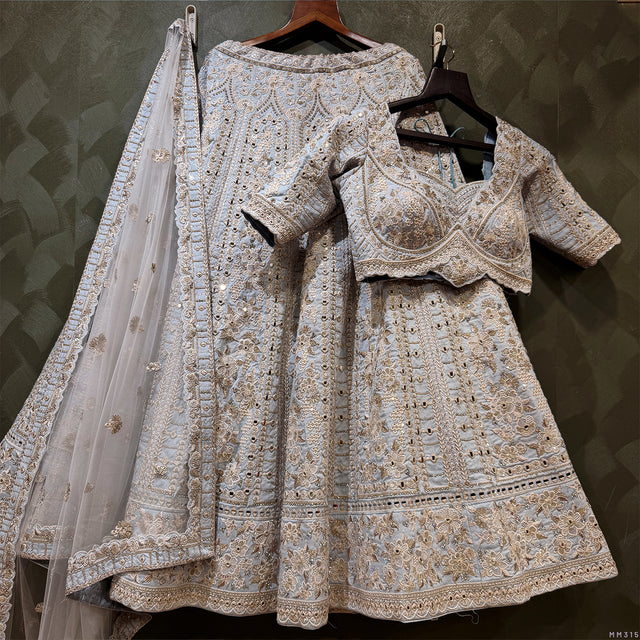 Light sky blue lehenga with ornate mirrorwork border and matching dupatta