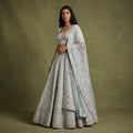 Sky blue lehenga with gold mirrorwork detailing and sheer dupatta, flared skirt