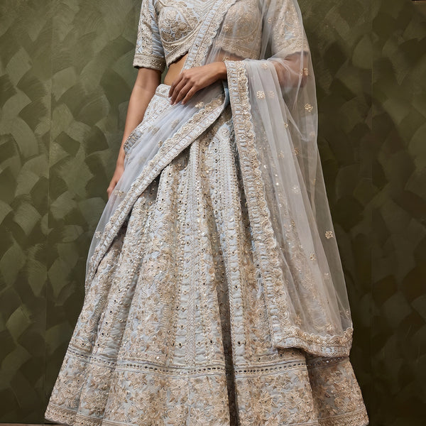 Sky blue mirrorwork lehenga skirt with ornate border and draped sheer dupatta