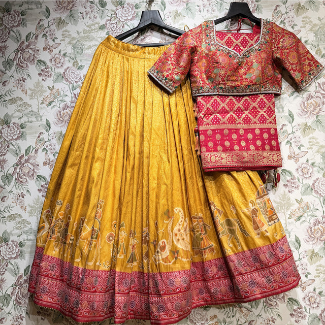 Mustard Banarasi lehenga with rani pink border, handwork blouse and dupatta on hangers