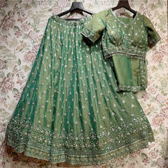 Green beaded and pearl-embellished lehenga skirt with matching embroidered blouse